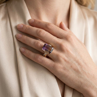 Emerald-cut gemstone ring — On Model - Jewelry Hands Detail | Generated by Modelize